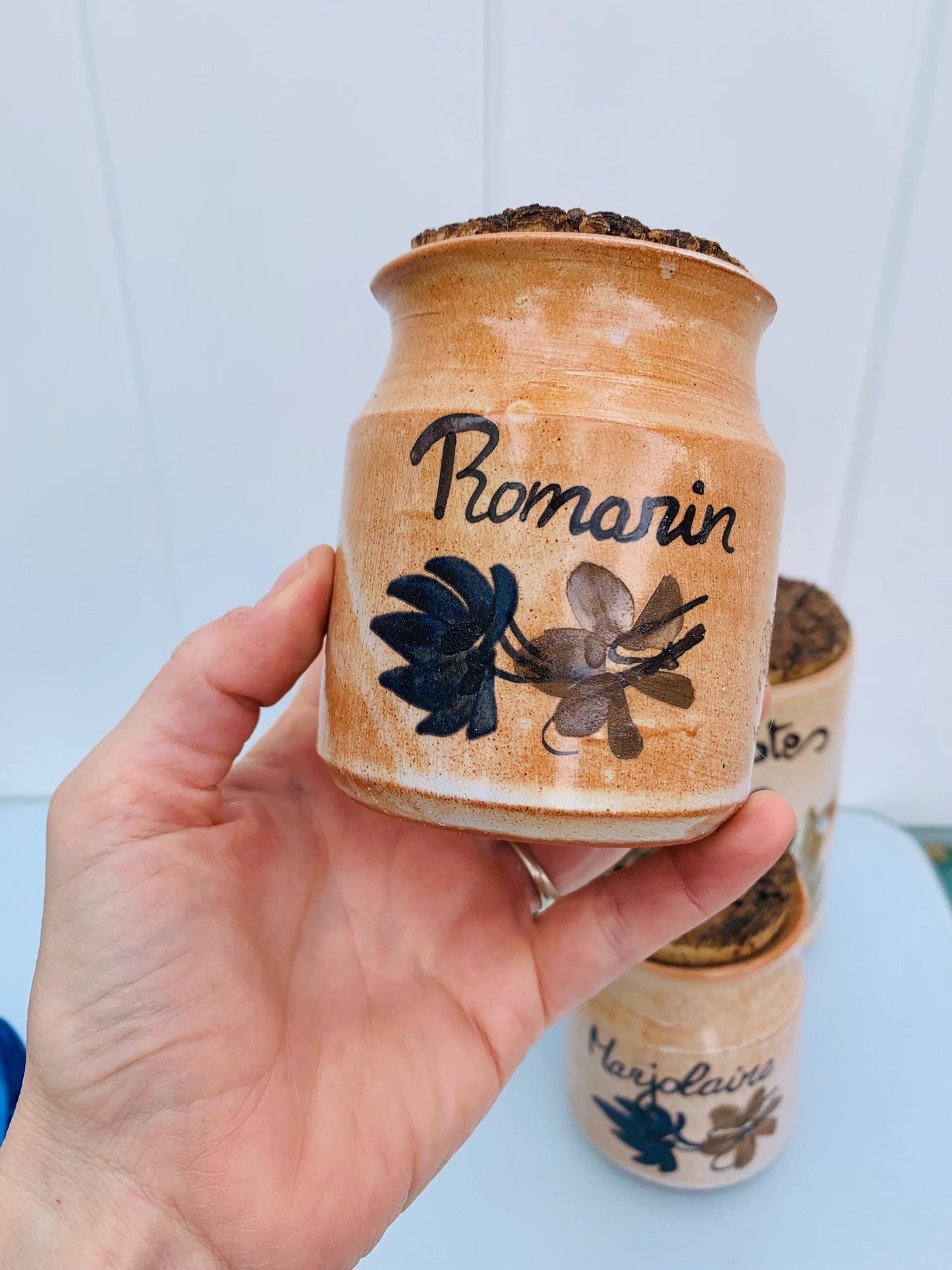 Set of 4 Pottery Canisters with Hand Painted Designs  with Cork Tops