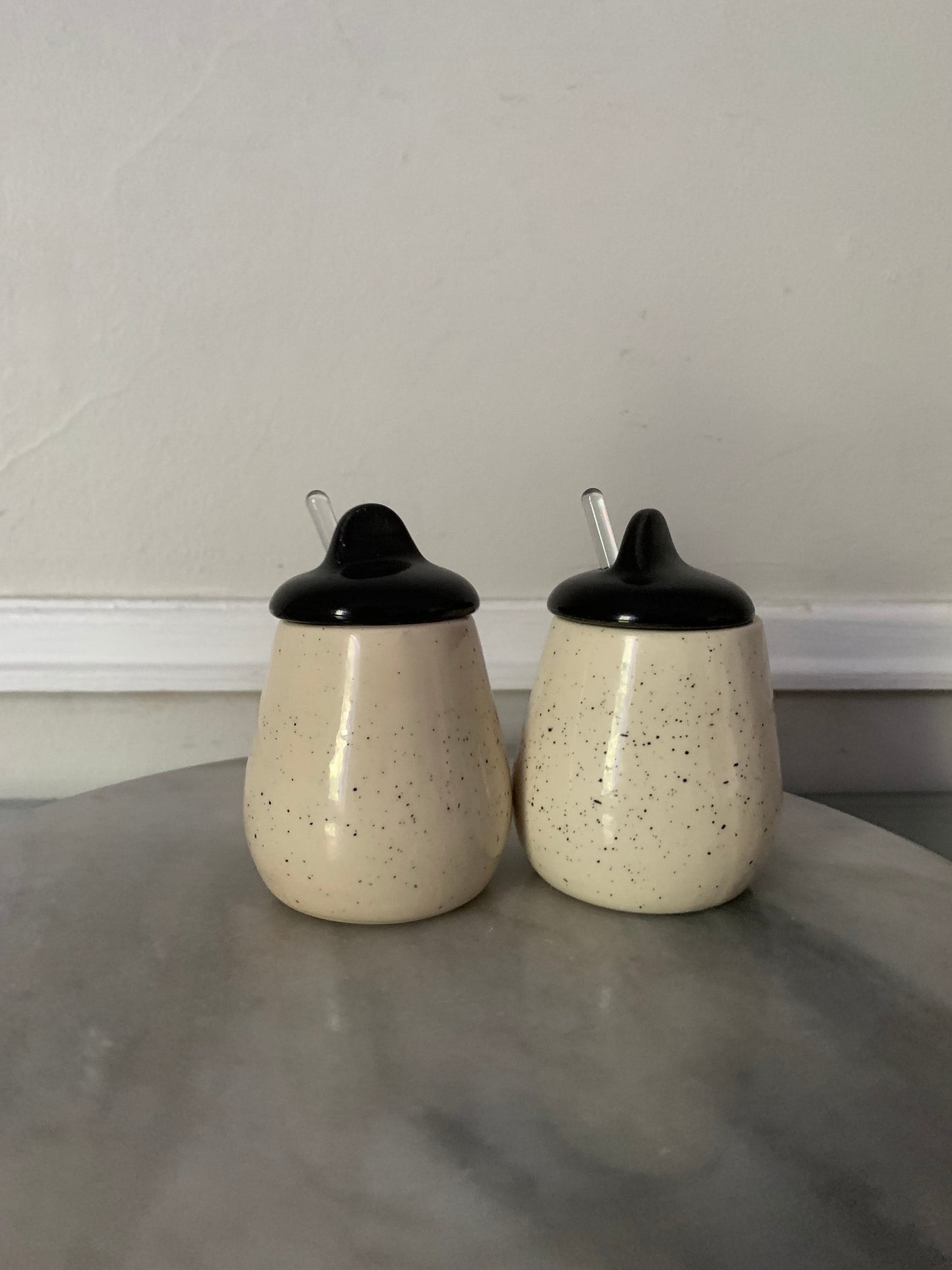 MCM Pair of Speckled White Ceramic Jars with Black Lid with Clear Glass Spoons