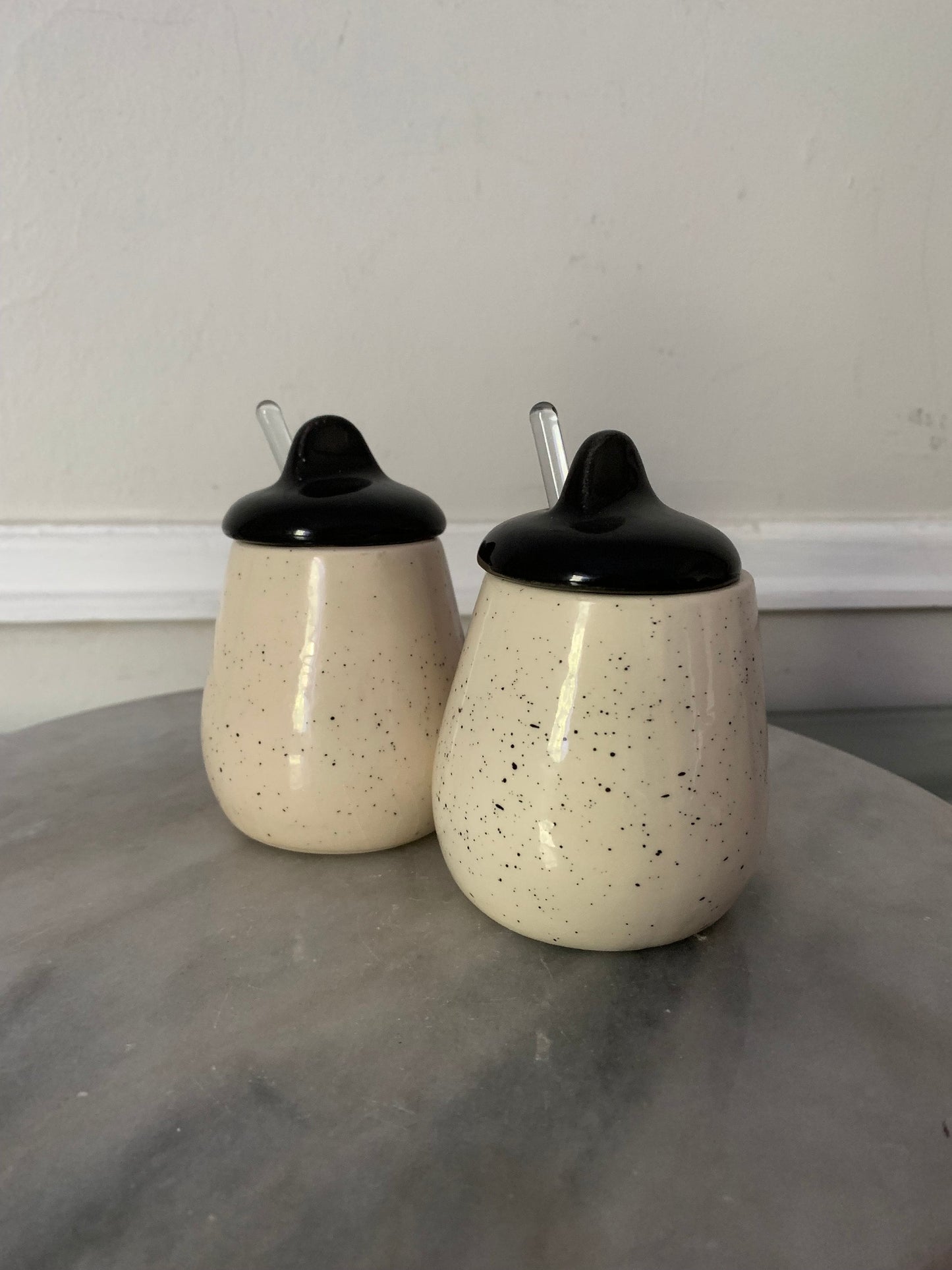 MCM Pair of Speckled White Ceramic Jars with Black Lid with Clear Glass Spoons